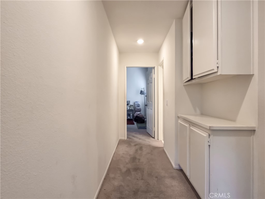 59 Rainbow Ridge Irvine, CA 92603 - Photo 20 of 35 a view of a hallway with closet and cabinet