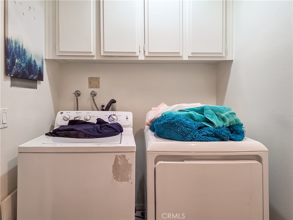 59 Rainbow Ridge Irvine, CA 92603 - Photo 22 of 35 a utility room with dryer and washer
