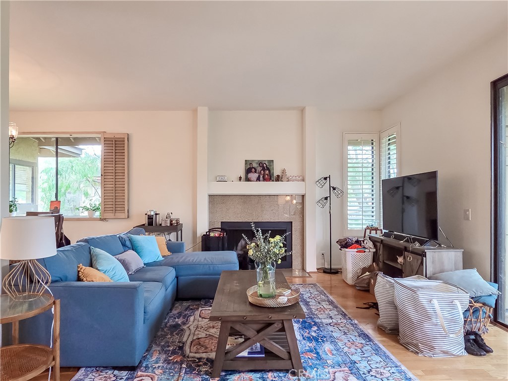 59 Rainbow Ridge Irvine, CA 92603 - Photo 6 of 35 a living room with furniture and a fireplace