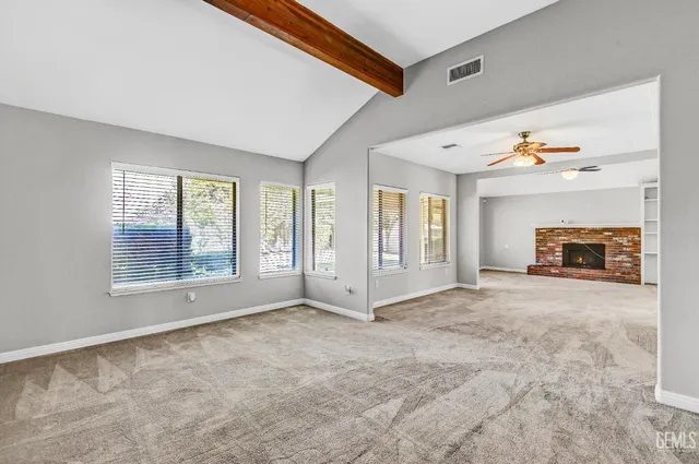 a view of livingroom with fireplace and window