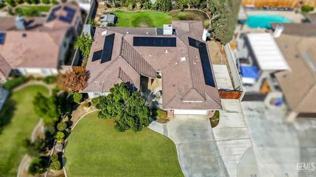 an aerial view of multiple houses with outdoor space