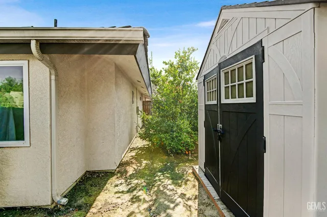 a view of a chairs and table in patio