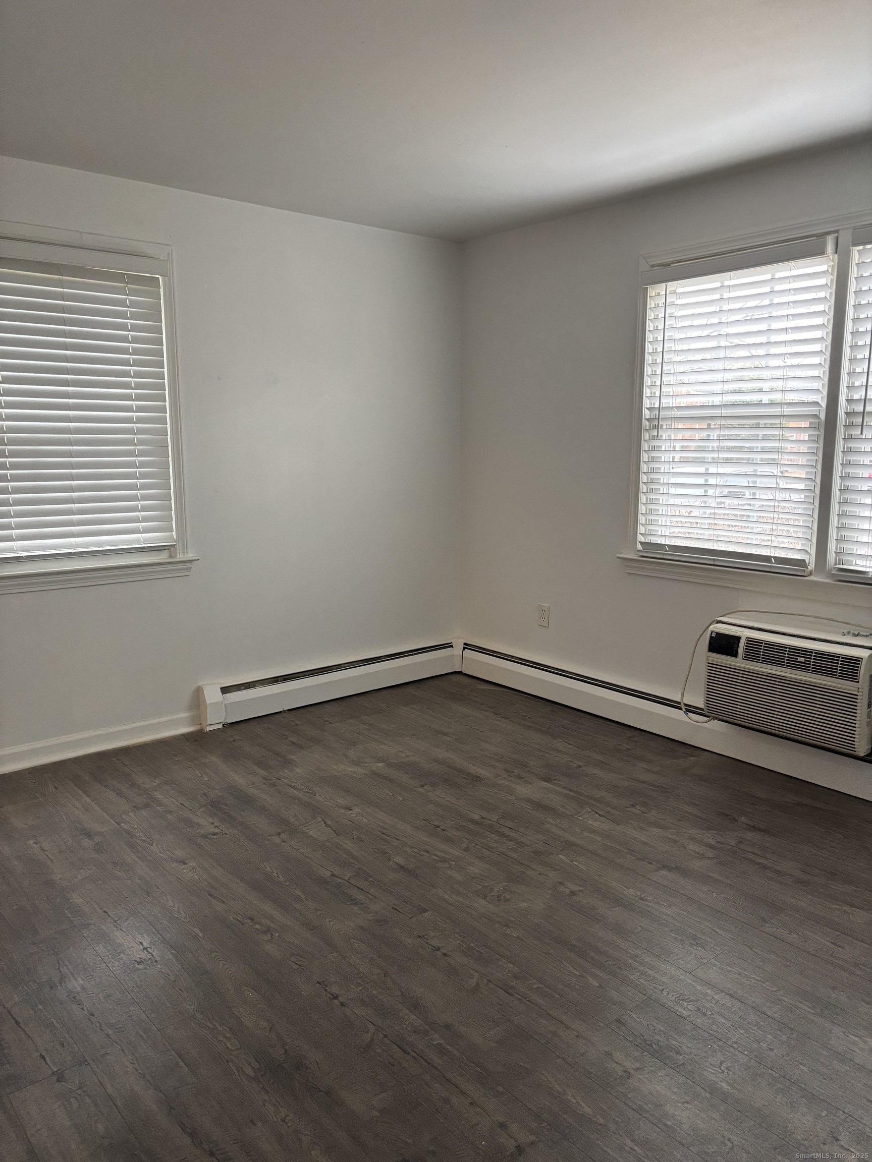 49 Grandview Drive, Unit A Farmington, CT 06032 - Photo 11 of 18 wooden floor in an empty room with a window
