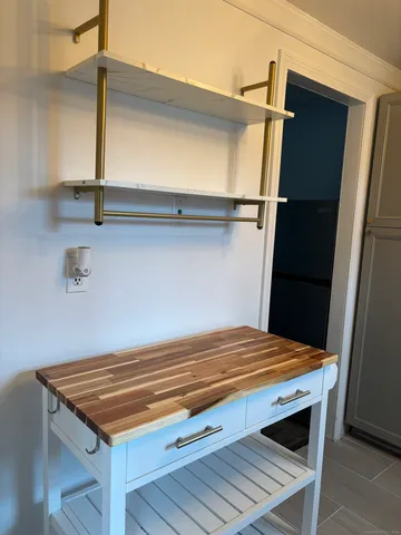 a view of room with wooden floor