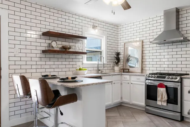 a kitchen with a sink cabinets and appliances