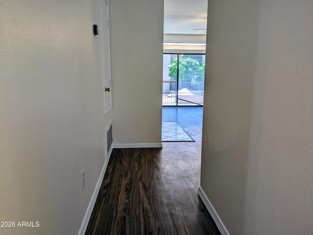 a view of a room with wooden floor and walls