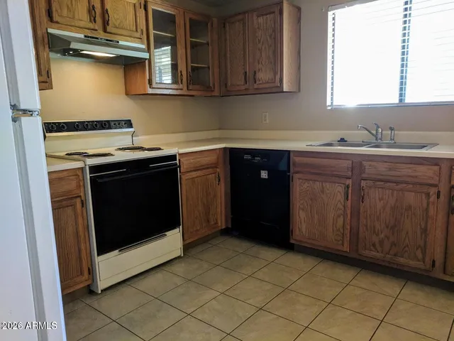 a kitchen with a stove and a sink