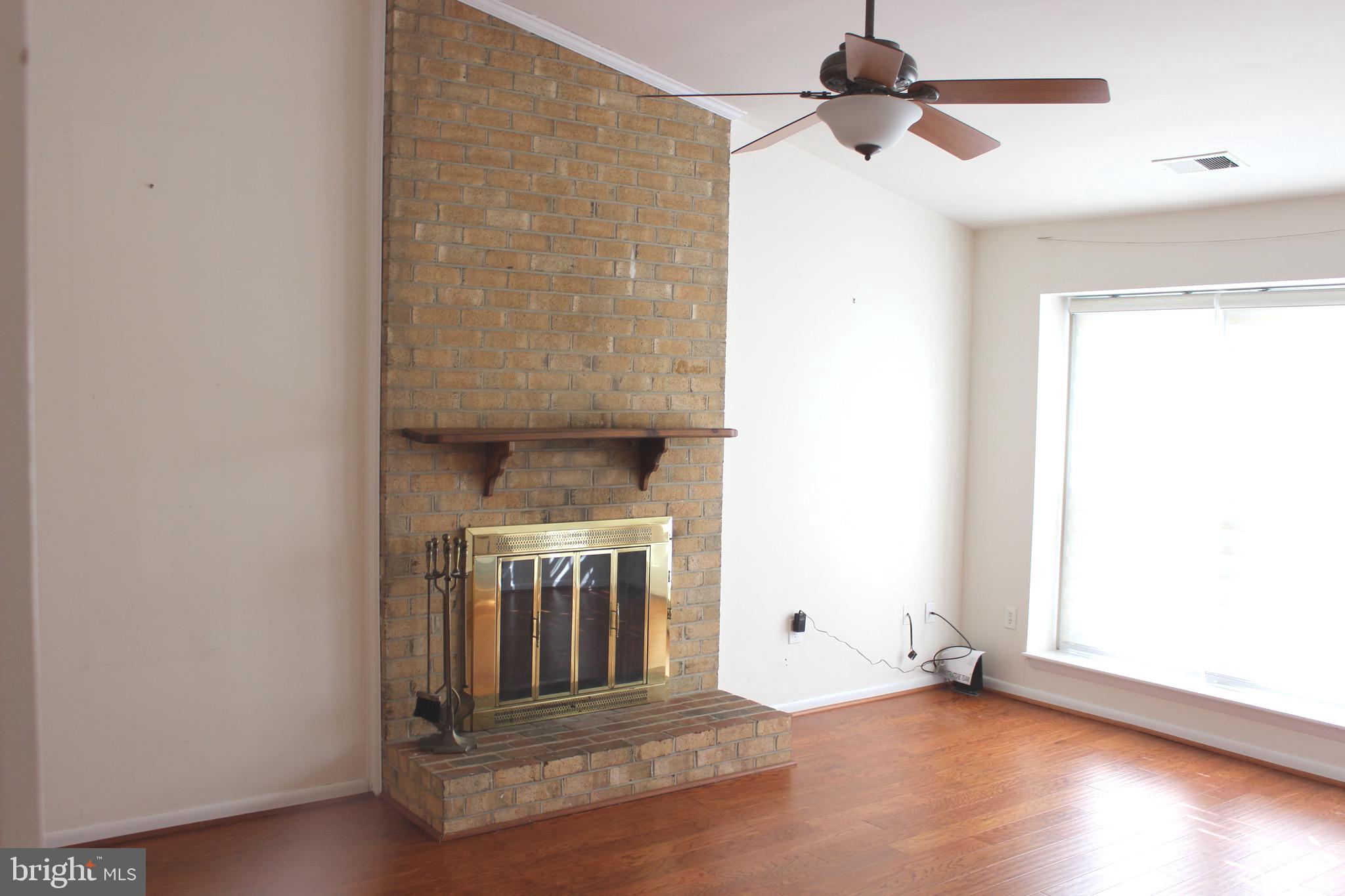 12716 Builders Road Herndon, VA 20170 - Photo 2 of 30 Family room w/cathedral ceiling & hardwood floors