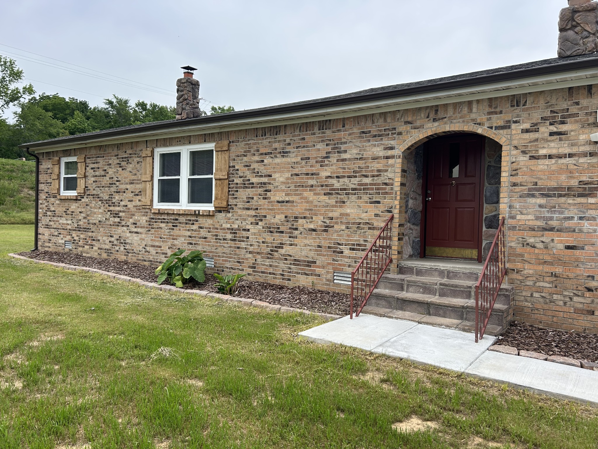 20 Ball Park Road Big Sandy, TN 38221 - Photo 2 of 33 a front view of a house with a yard