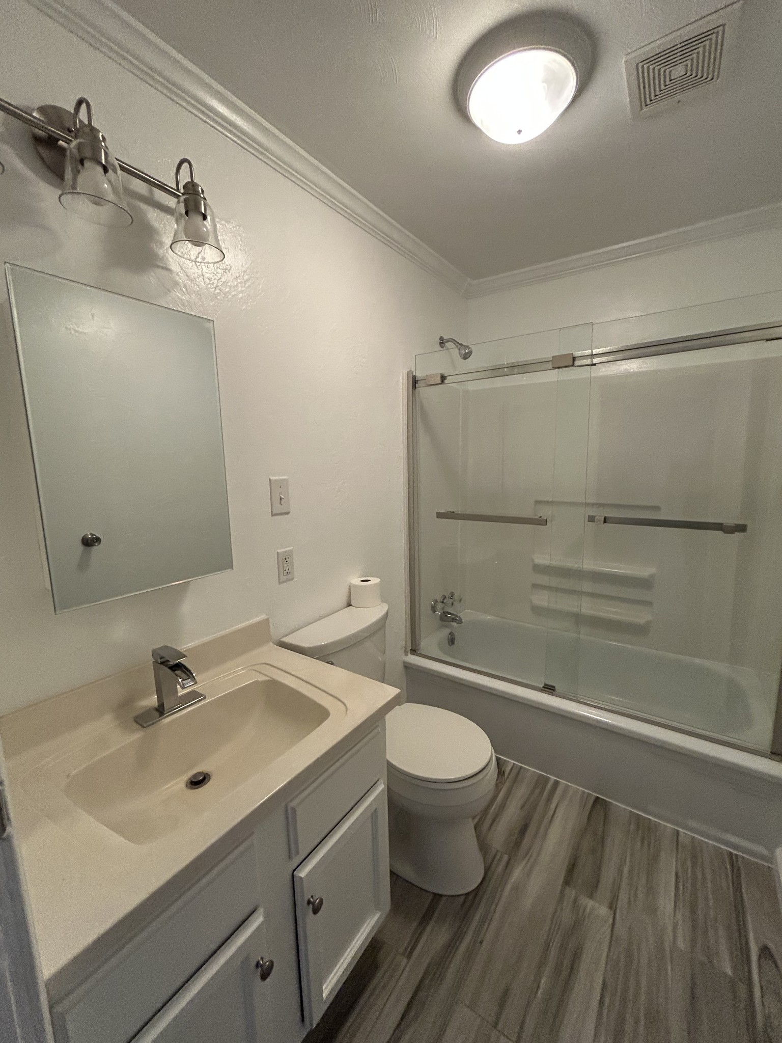 20 Ball Park Road Big Sandy, TN 38221 - Photo 25 of 33 a bathroom with a sink mirror toilet and shower