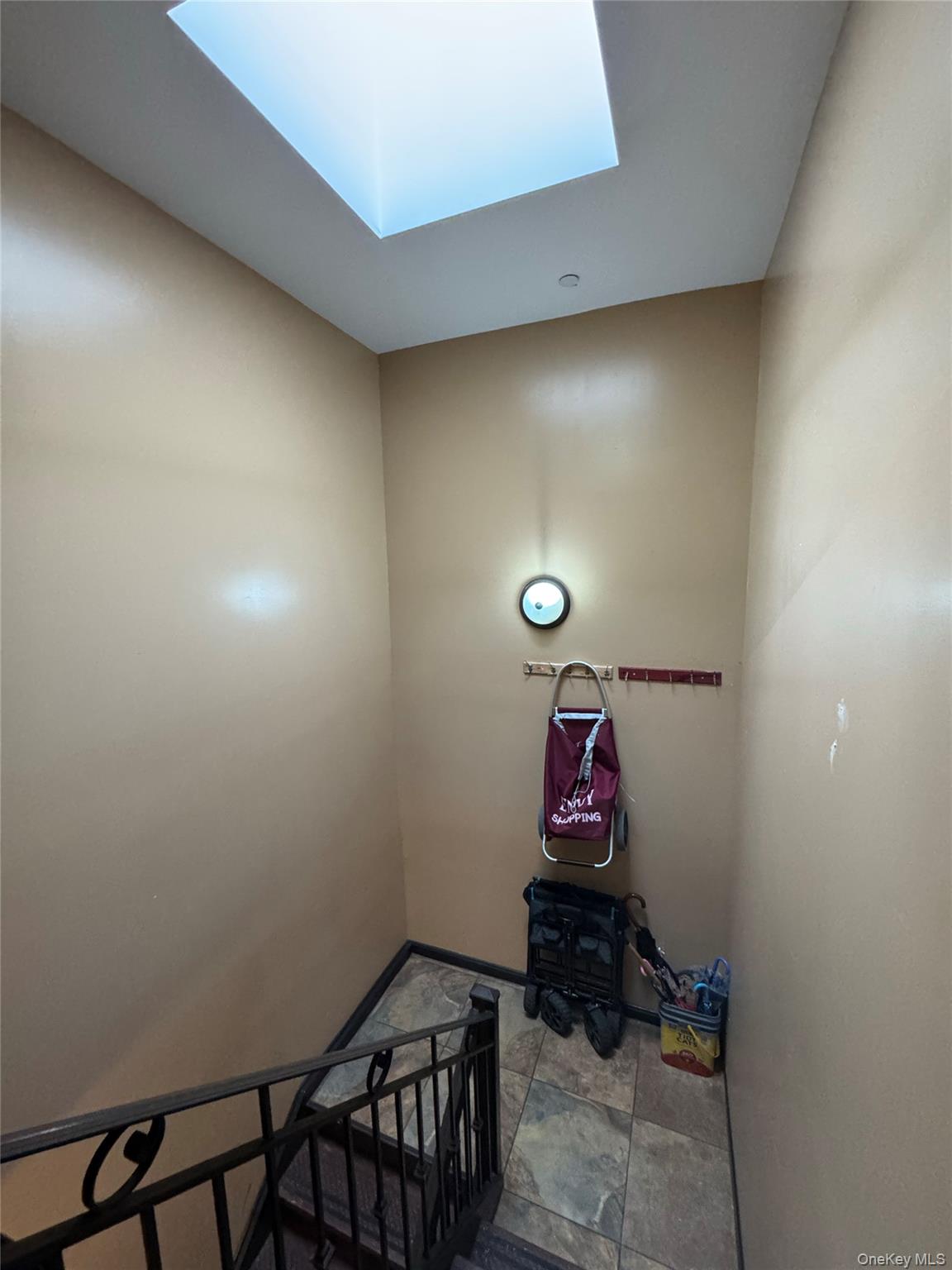 101-20 39th Avenue Queens, NY 11368 - Photo 14 of 17 a room with water heater and wooden cabinets