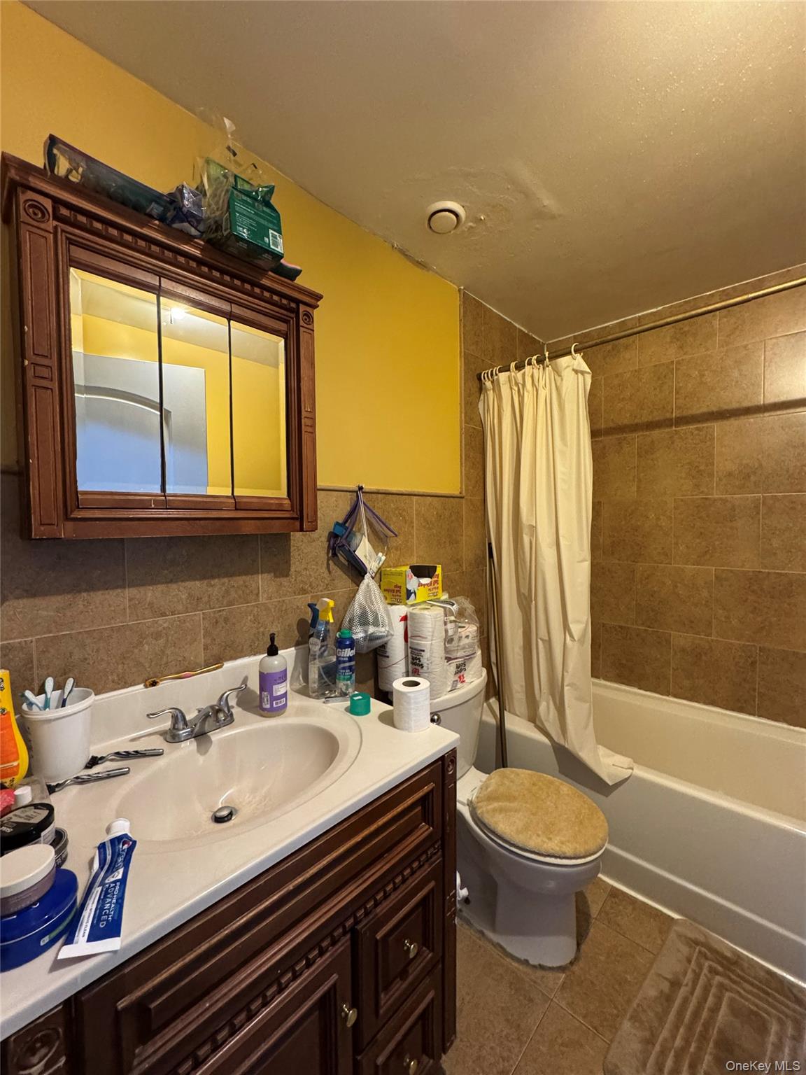 101-20 39th Avenue Queens, NY 11368 - Photo 5 of 17 a bathroom with a sink a toilet and shower