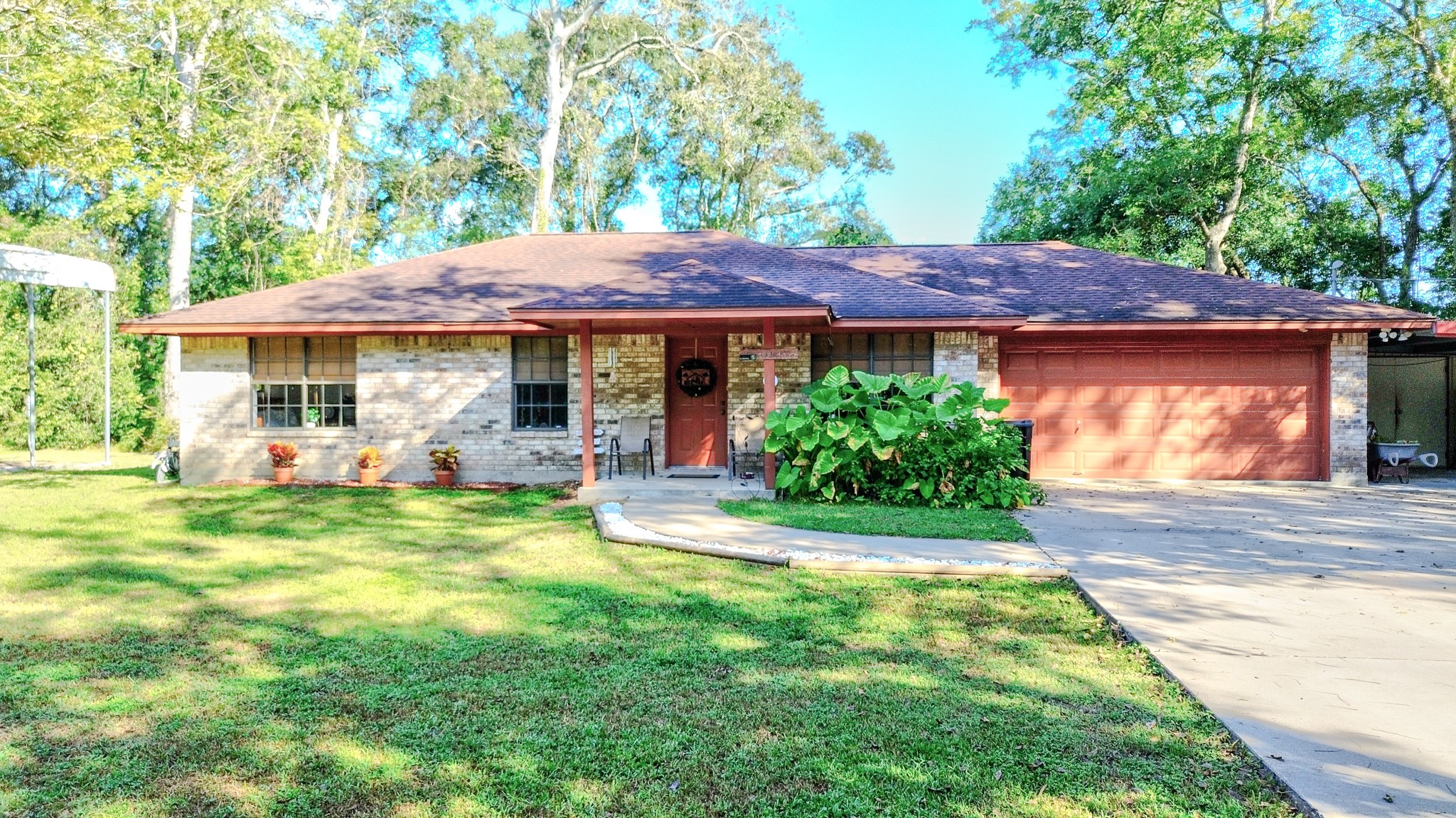 3504 FM 522 Road Brazoria, TX 77422 - Photo 1 of 40 a front view of a house with a garden