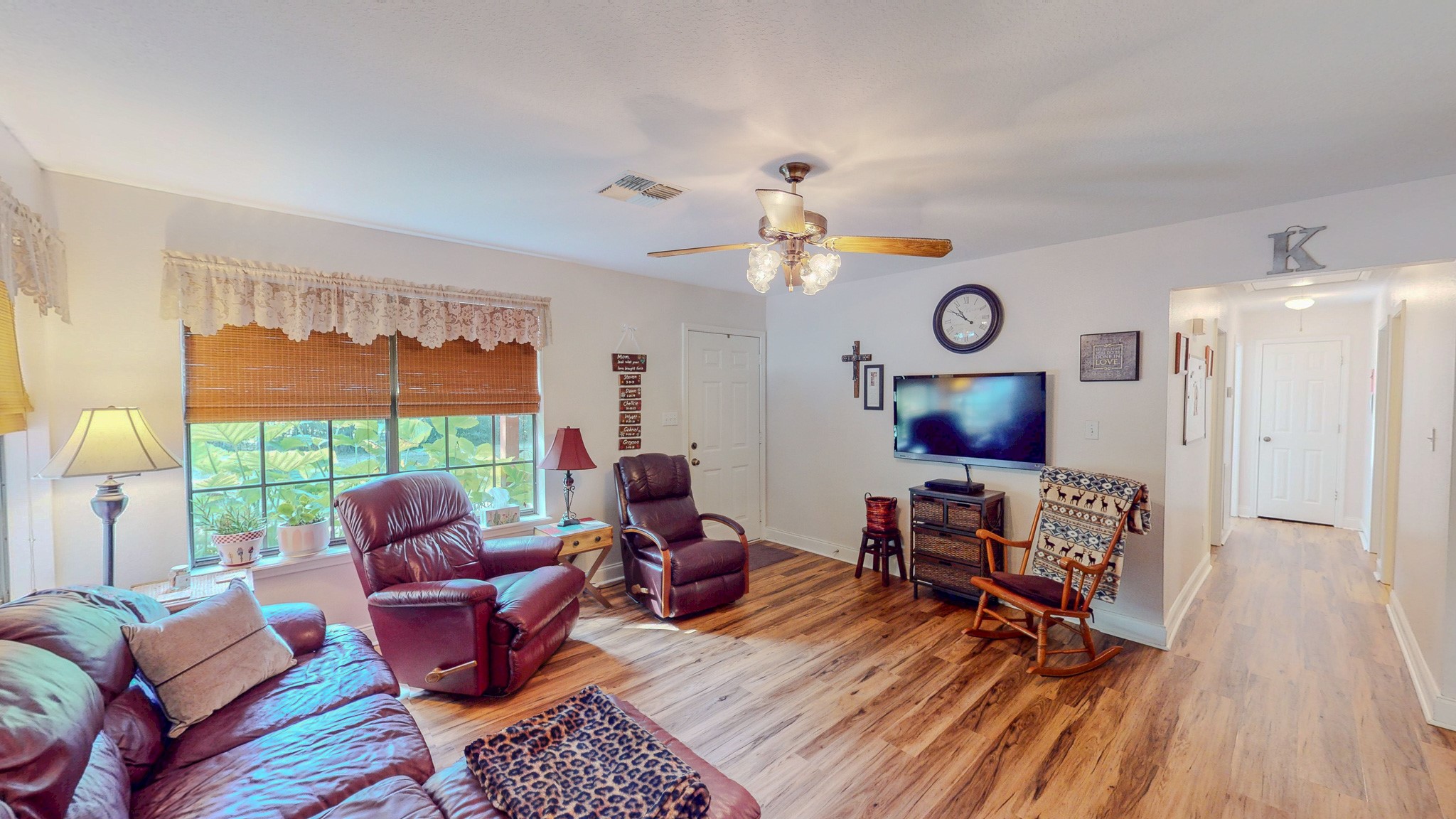3504 FM 522 Road Brazoria, TX 77422 - Photo 12 of 40 a living room with furniture a fireplace and a window