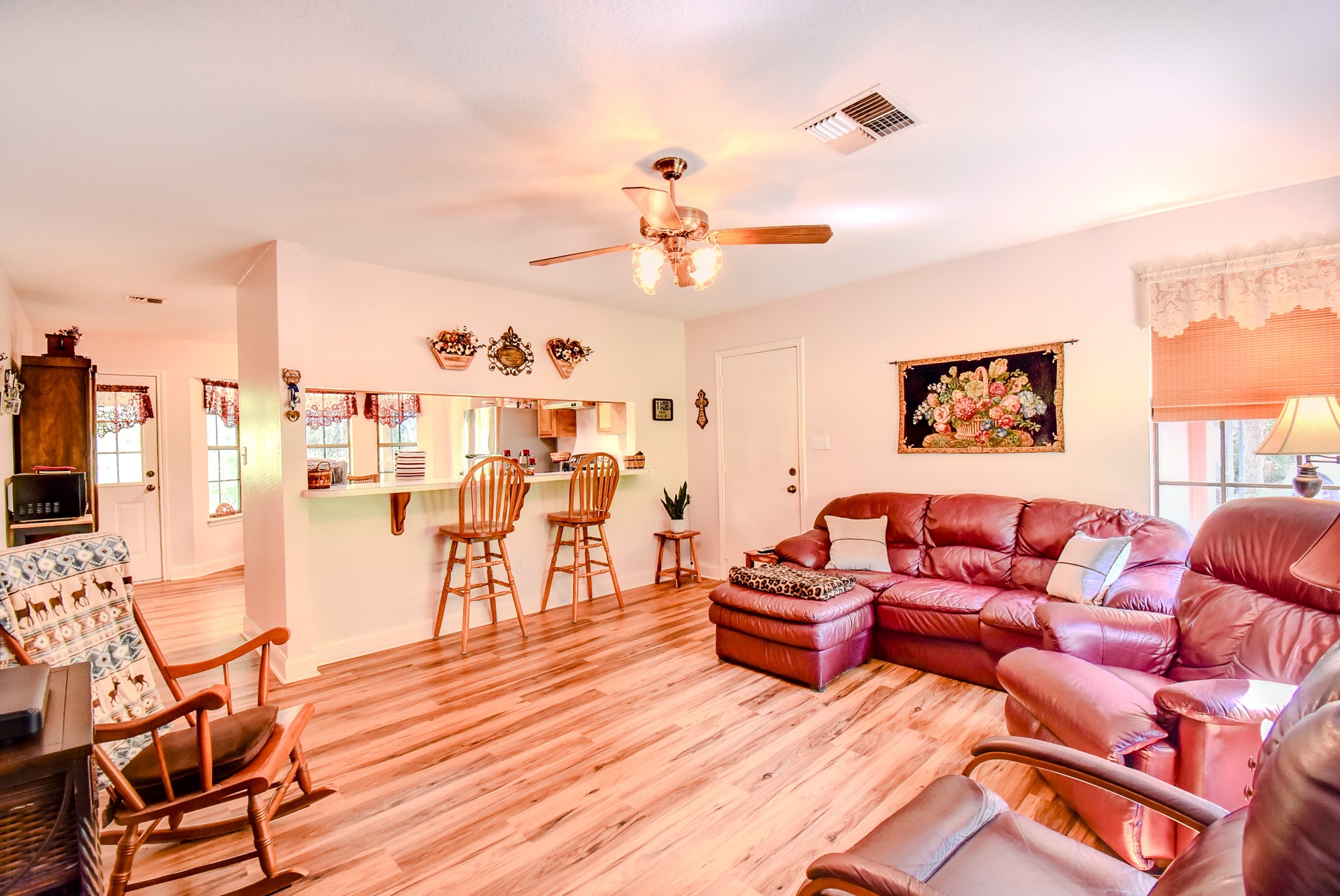 3504 FM 522 Road Brazoria, TX 77422 - Photo 13 of 40 a living room with furniture a rug and a chandelier
