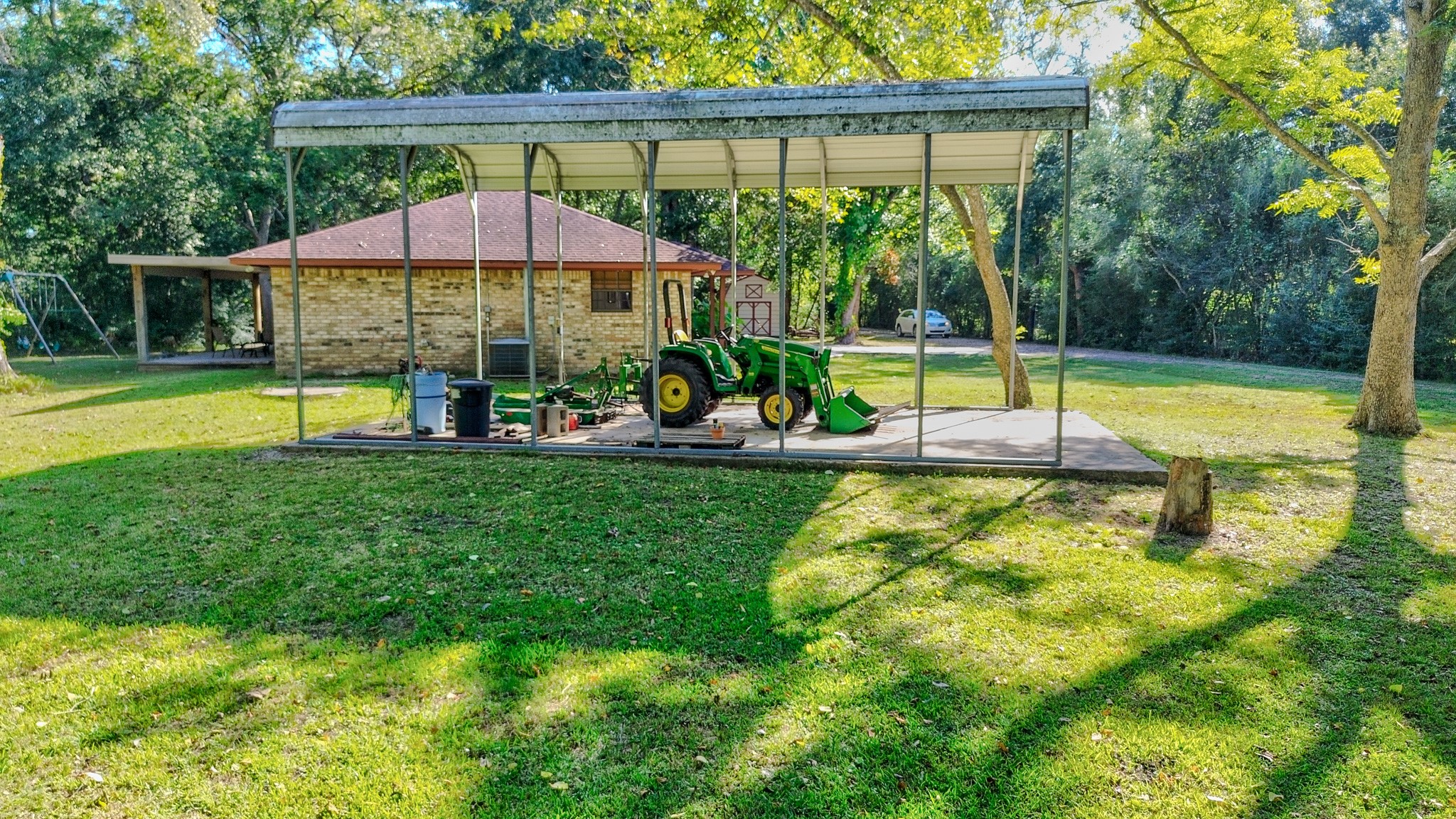 3504 FM 522 Road Brazoria, TX 77422 - Photo 29 of 40 a view of a swimming pool with lawn chairs under an umbrella