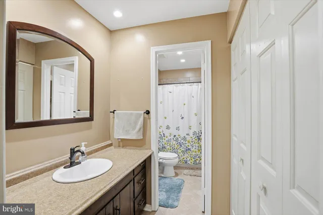 a bathroom with a shower and a sink