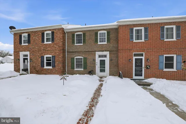 a front view of a house with yard