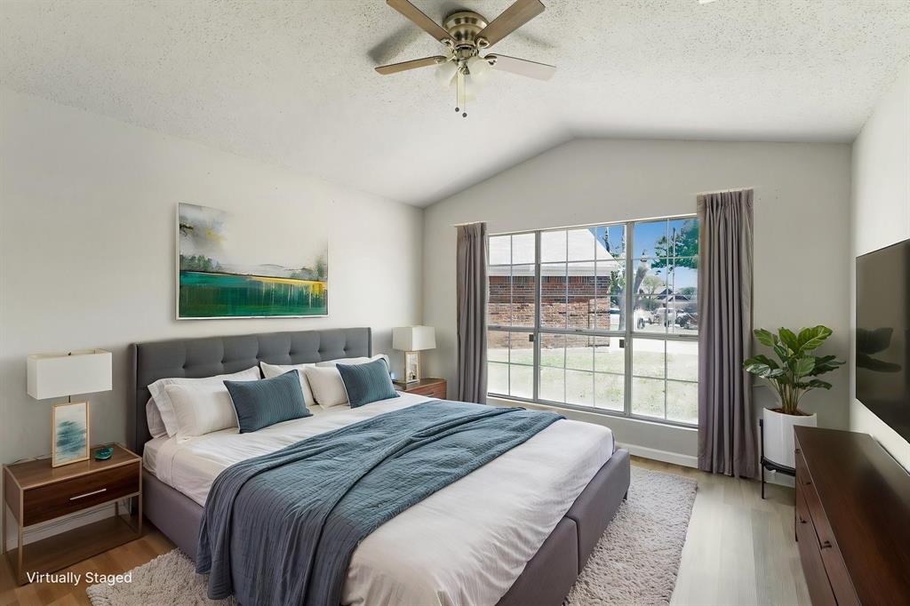 1019 Danforth Court Arlington, TX 76017 - Photo 17 of 37 a bedroom with a balcony a bed and a large window