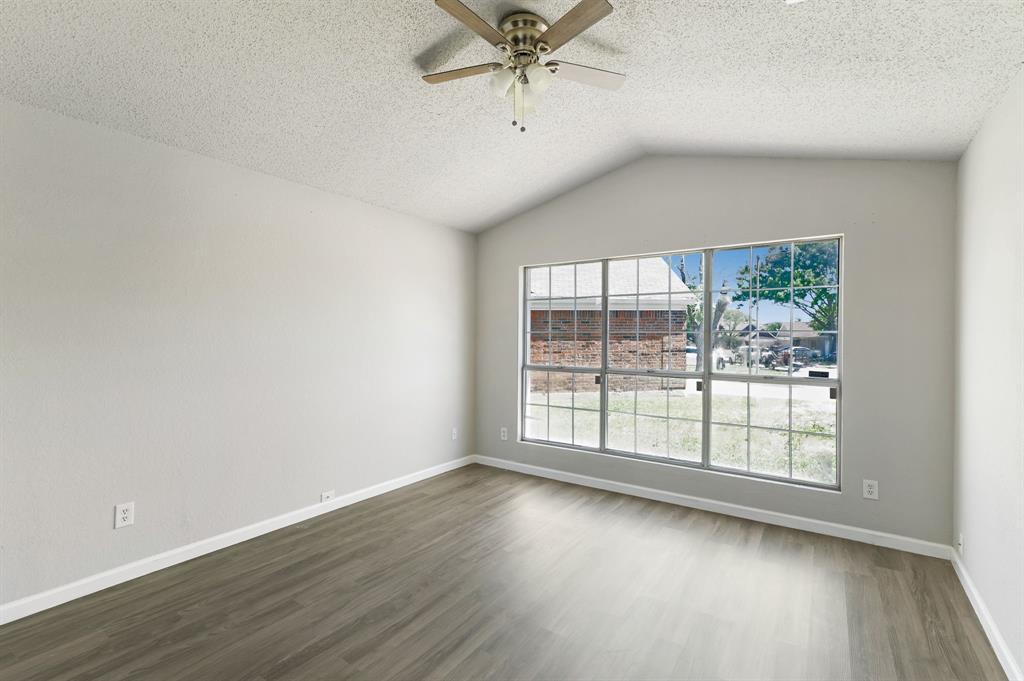 1019 Danforth Court Arlington, TX 76017 - Photo 18 of 37 wooden floor in an empty room with a window