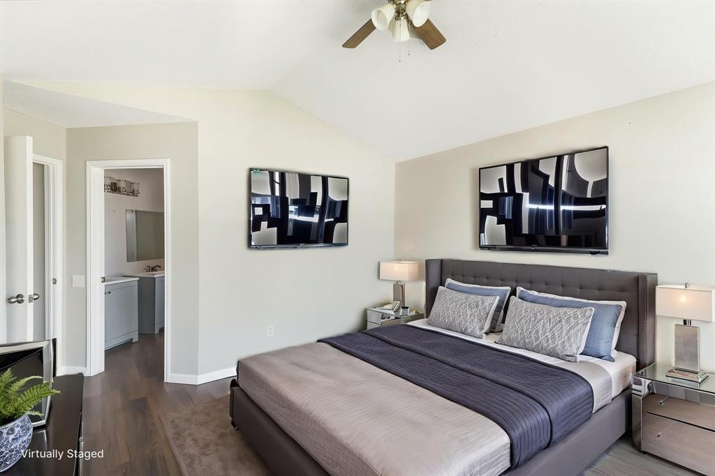 1019 Danforth Court Arlington, TX 76017 - Photo 19 of 37 a bedroom with a bed and wooden floor