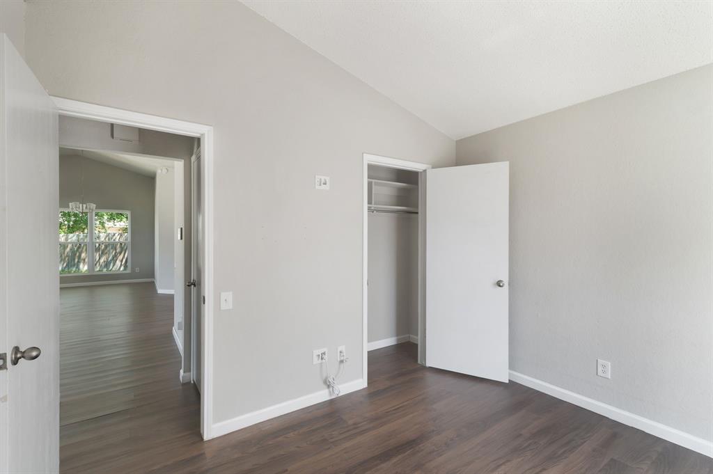 1019 Danforth Court Arlington, TX 76017 - Photo 25 of 37 an empty room with wooden floor and a window