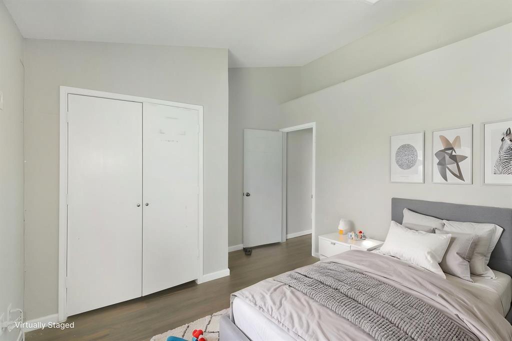 1019 Danforth Court Arlington, TX 76017 - Photo 28 of 37 a bedroom with a bed and a walk in closet