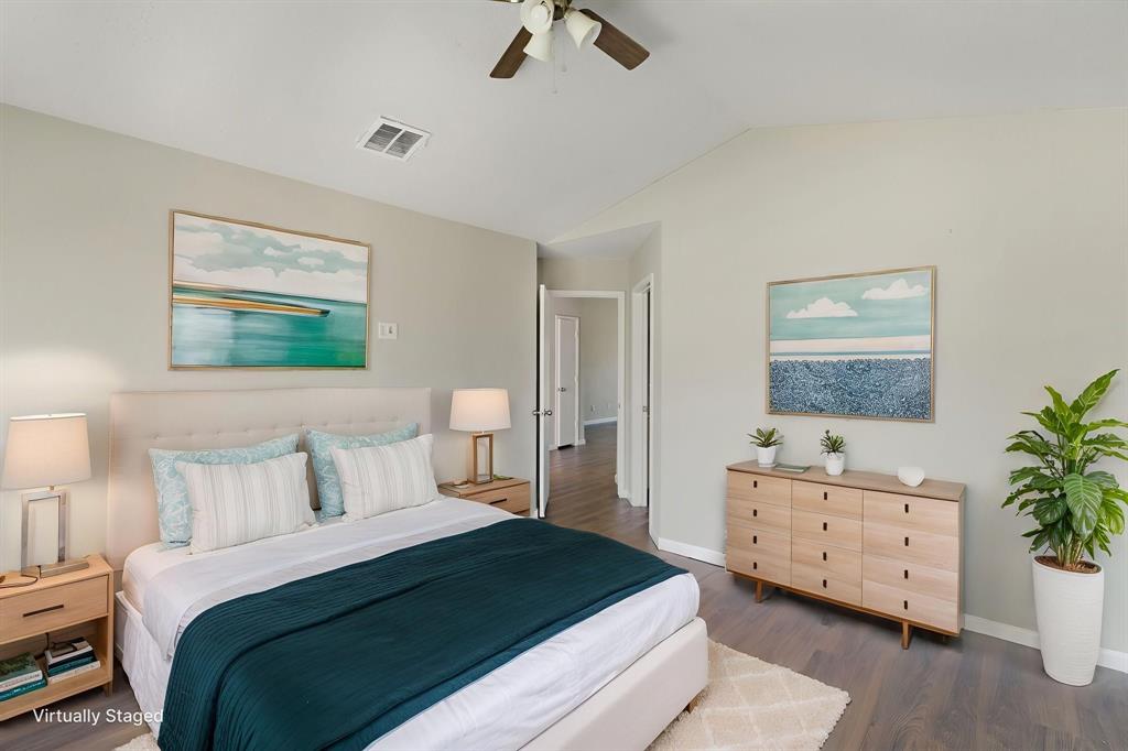 1019 Danforth Court Arlington, TX 76017 - Photo 30 of 37 a bedroom with a bed and a potted plant