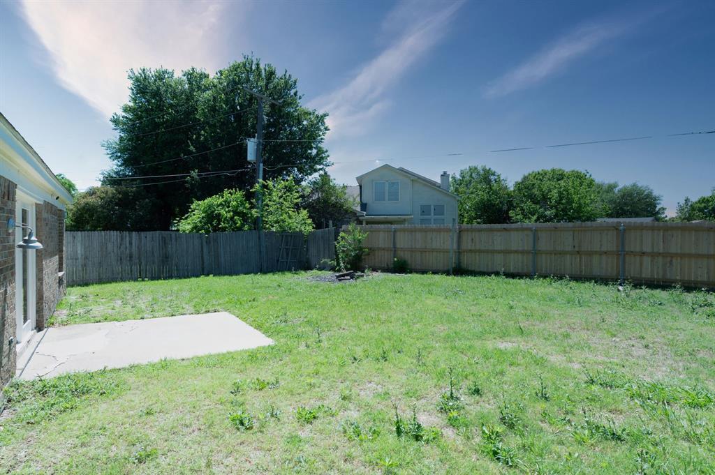 1019 Danforth Court Arlington, TX 76017 - Photo 35 of 37 a view of a backyard with wooden fence