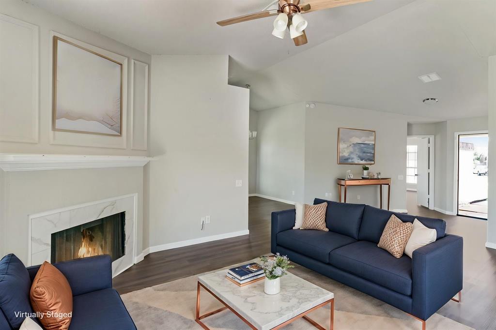 1019 Danforth Court Arlington, TX 76017 - Photo 8 of 37 a living room with furniture and a fireplace