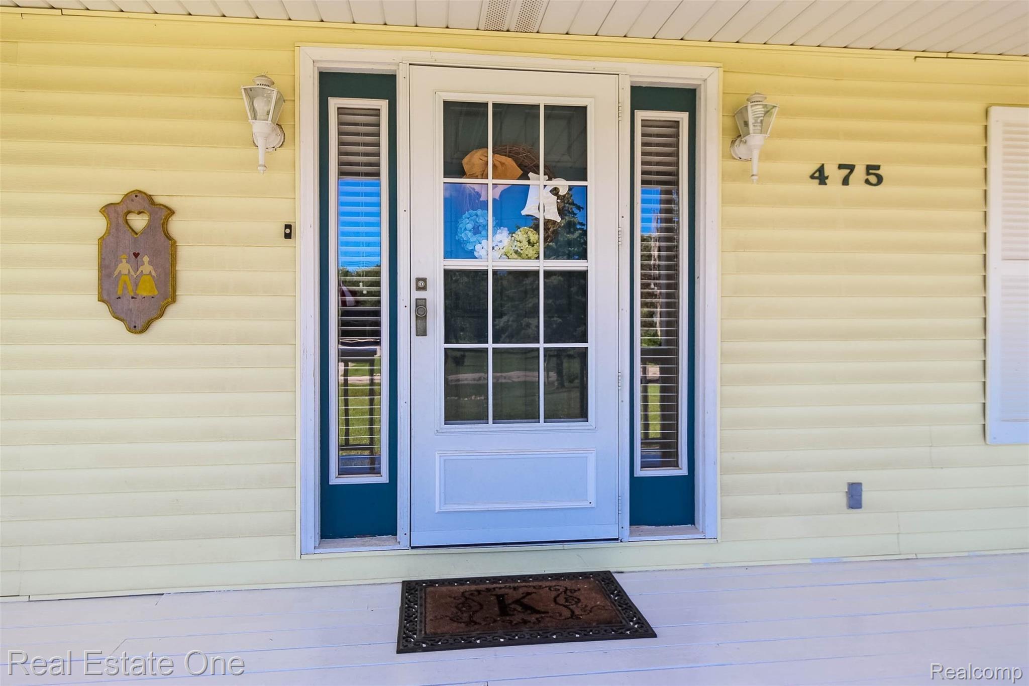 Front door with side lights for natural light into foyer 