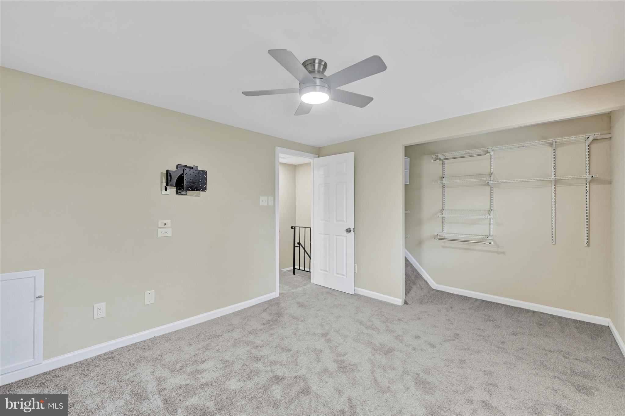 3447 Santee Road Baltimore, MD 21236 - Photo 16 of 32 a view of an empty room with a ceiling fan