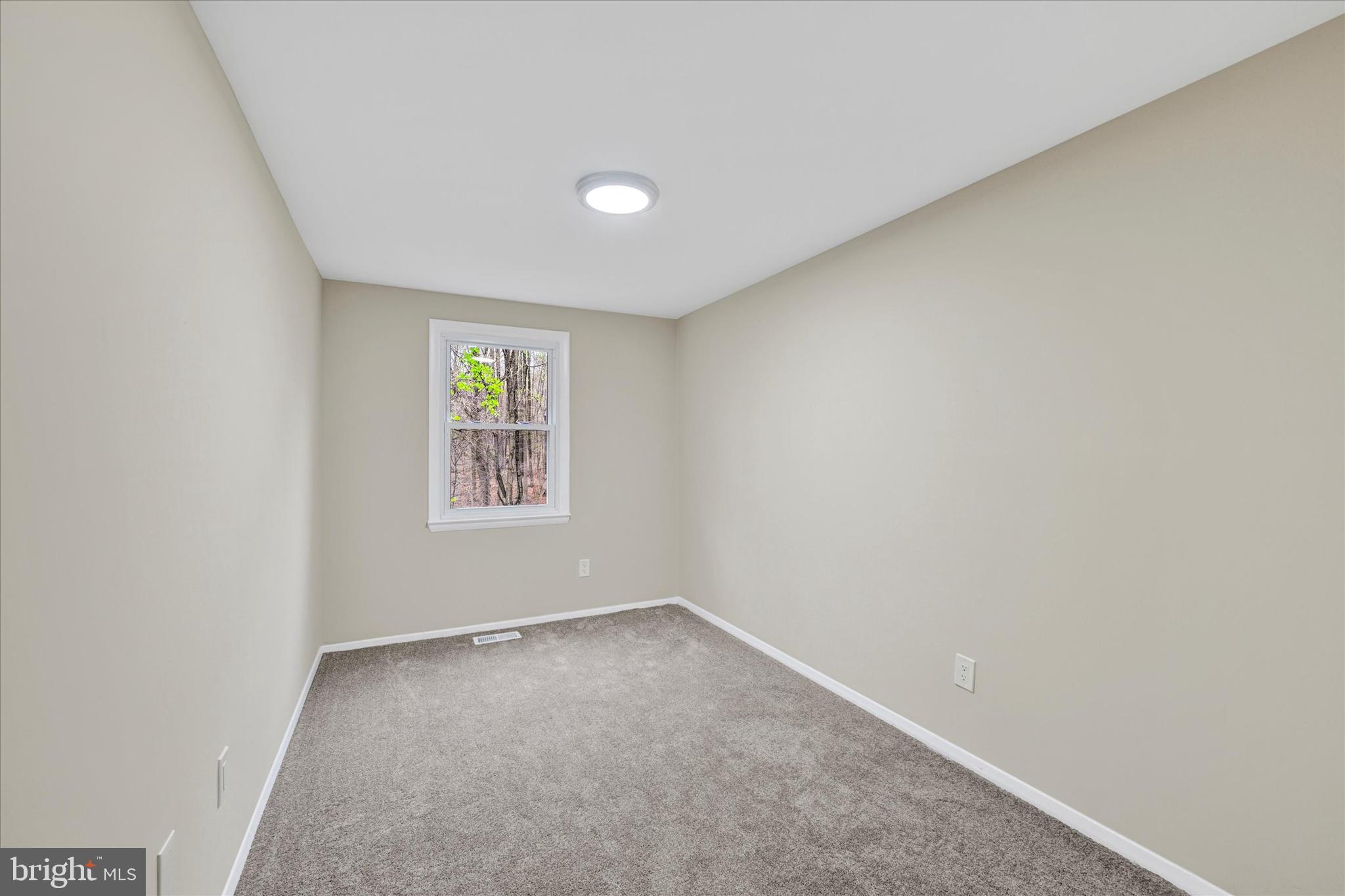 3447 Santee Road Baltimore, MD 21236 - Photo 19 of 32 a view of an empty room with a window