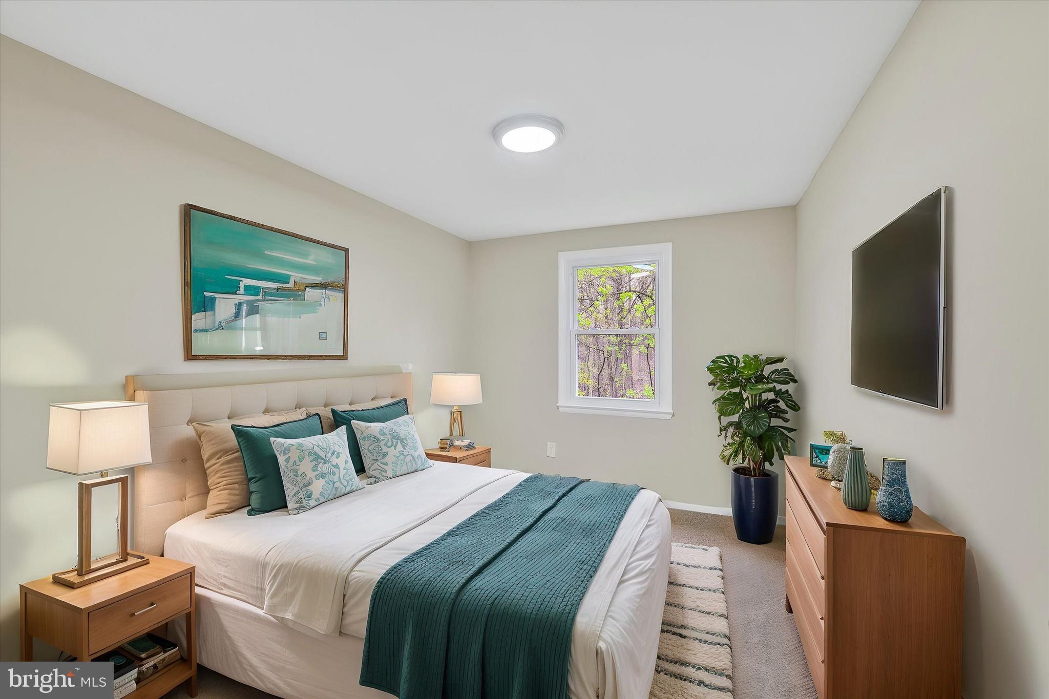 3447 Santee Road Baltimore, MD 21236 - Photo 20 of 32 a bedroom with bed and a flat screen tv