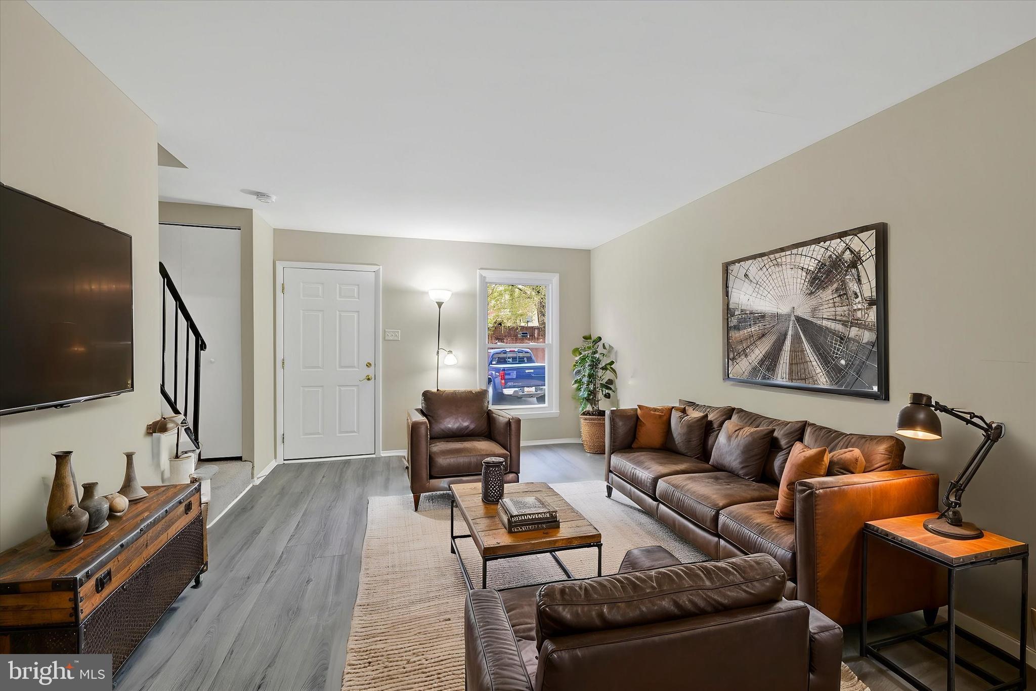 3447 Santee Road Baltimore, MD 21236 - Photo 2 of 32 a living room with furniture and a flat screen tv