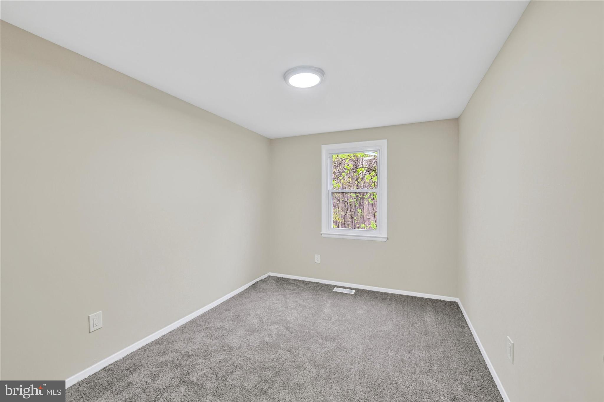 3447 Santee Road Baltimore, MD 21236 - Photo 21 of 32 an empty room with a window