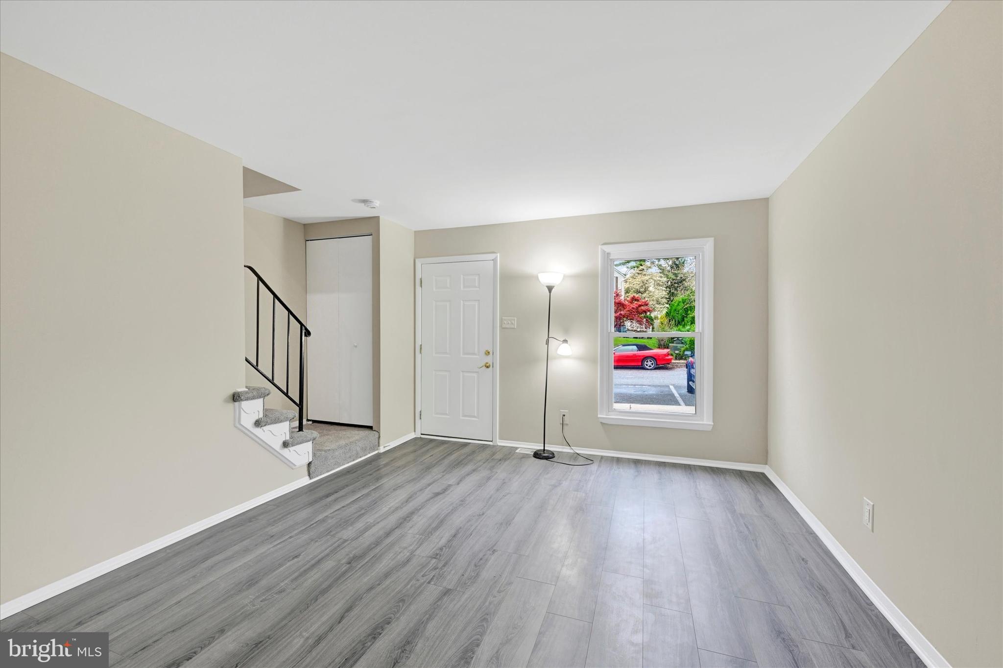 3447 Santee Road Baltimore, MD 21236 - Photo 4 of 32 a view of a hallway with wooden floor and entryway