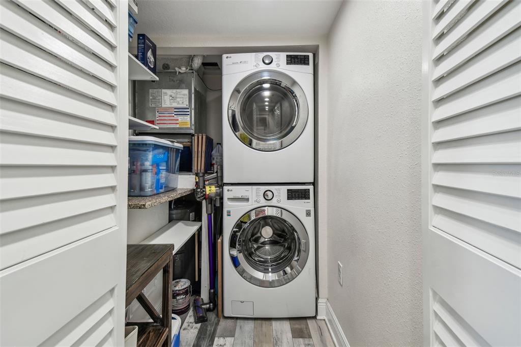 5915 Sea Ranch Drive, Unit 703 Hudson, FL 34667 - Photo 11 of 54 a view of a bedroom with washer and dryer