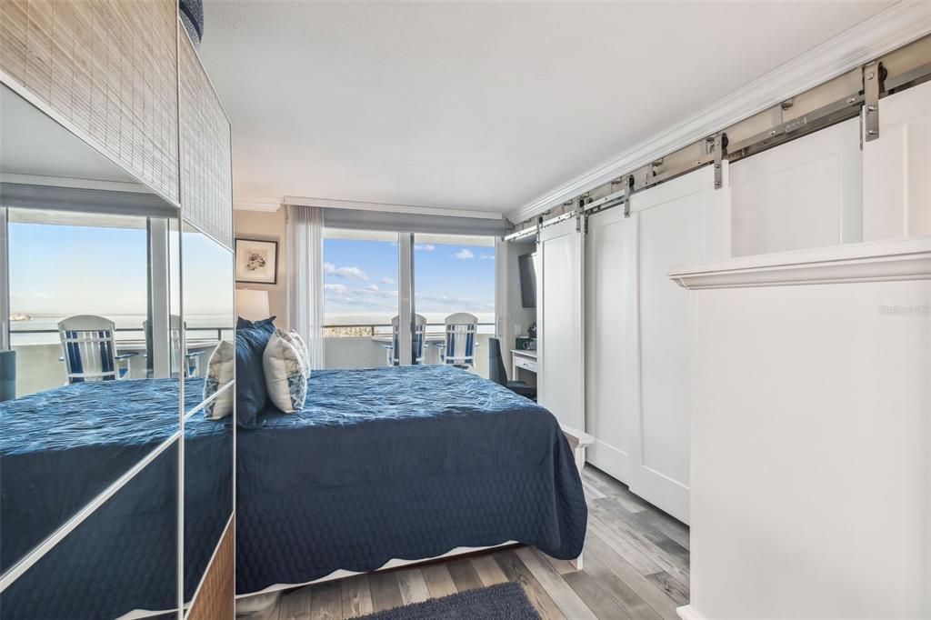 5915 Sea Ranch Drive, Unit 703 Hudson, FL 34667 - Photo 16 of 54 a living room with a bed and furniture