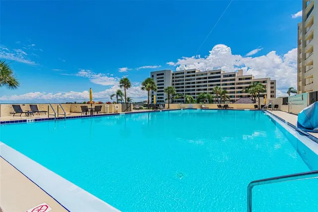a view of a livingroom with furniture and a kitchen