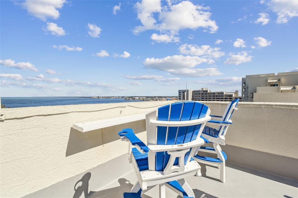 5915 Sea Ranch Drive, Unit 703 Hudson, FL 34667 - Photo 2 of 54 a view of a chairs and table in the terrace