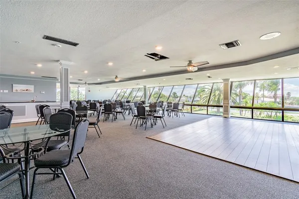 a view of a studio with dining room wooden floor and windows