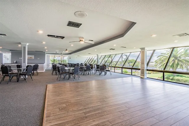 a room with furniture and a projector screen