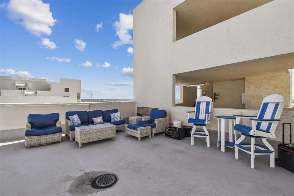 5915 Sea Ranch Drive, Unit 703 Hudson, FL 34667 - Photo 49 of 54 a living room with furniture and a flat screen tv