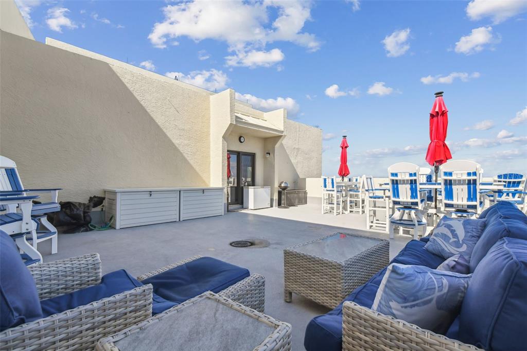 5915 Sea Ranch Drive, Unit 703 Hudson, FL 34667 - Photo 50 of 54 a living room with furniture and a chandelier