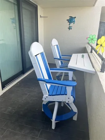 a view of table and chairs in the room