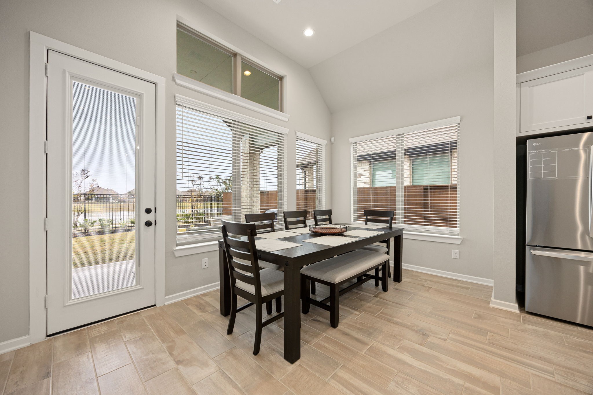 4823 Vaughan Way Iowa Colony, TX 77583 - Photo 11 of 29 a view of a kitchen area with furniture and wooden floor