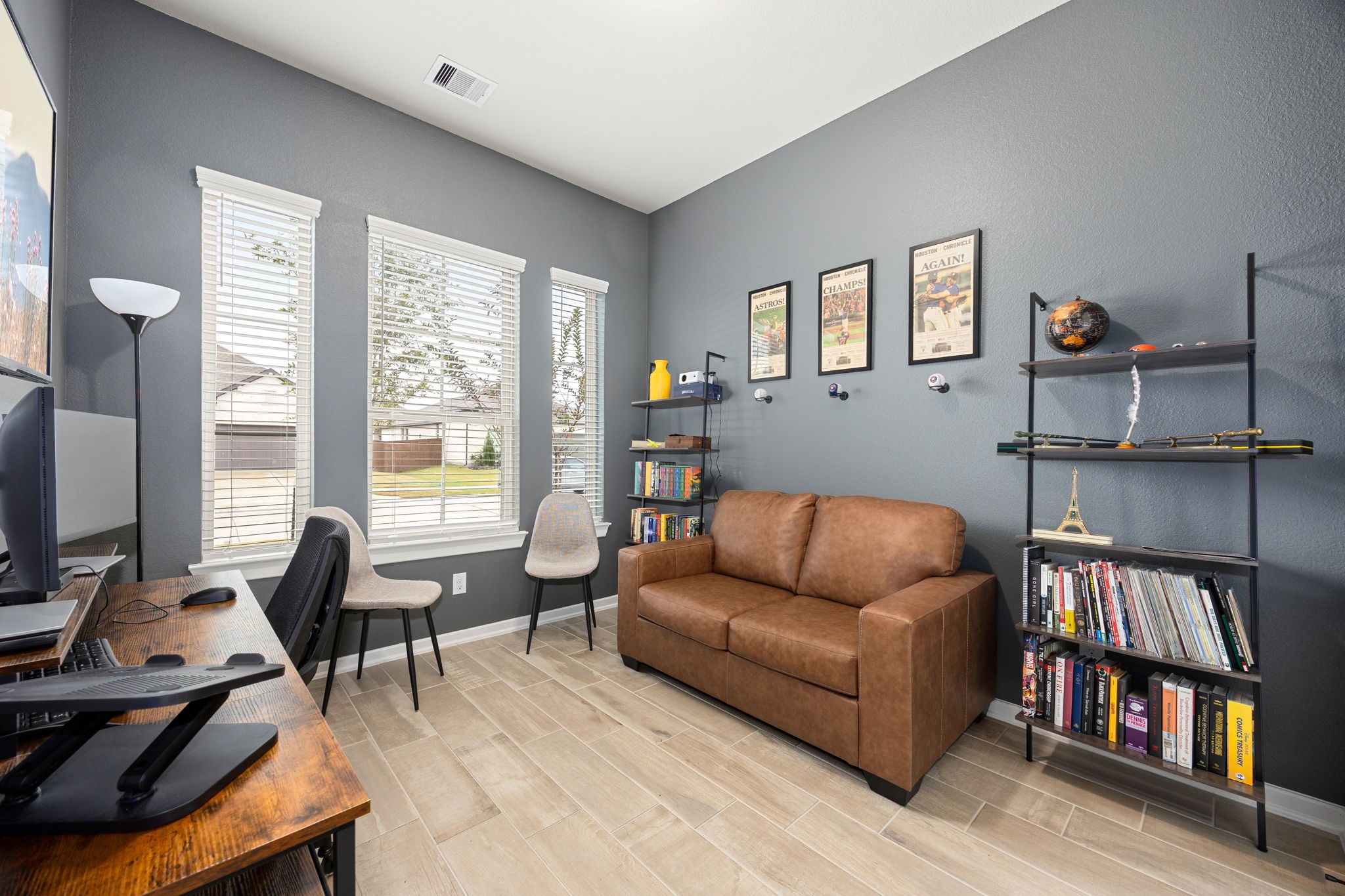 4823 Vaughan Way Iowa Colony, TX 77583 - Photo 16 of 29 a living room with furniture and a book shelf