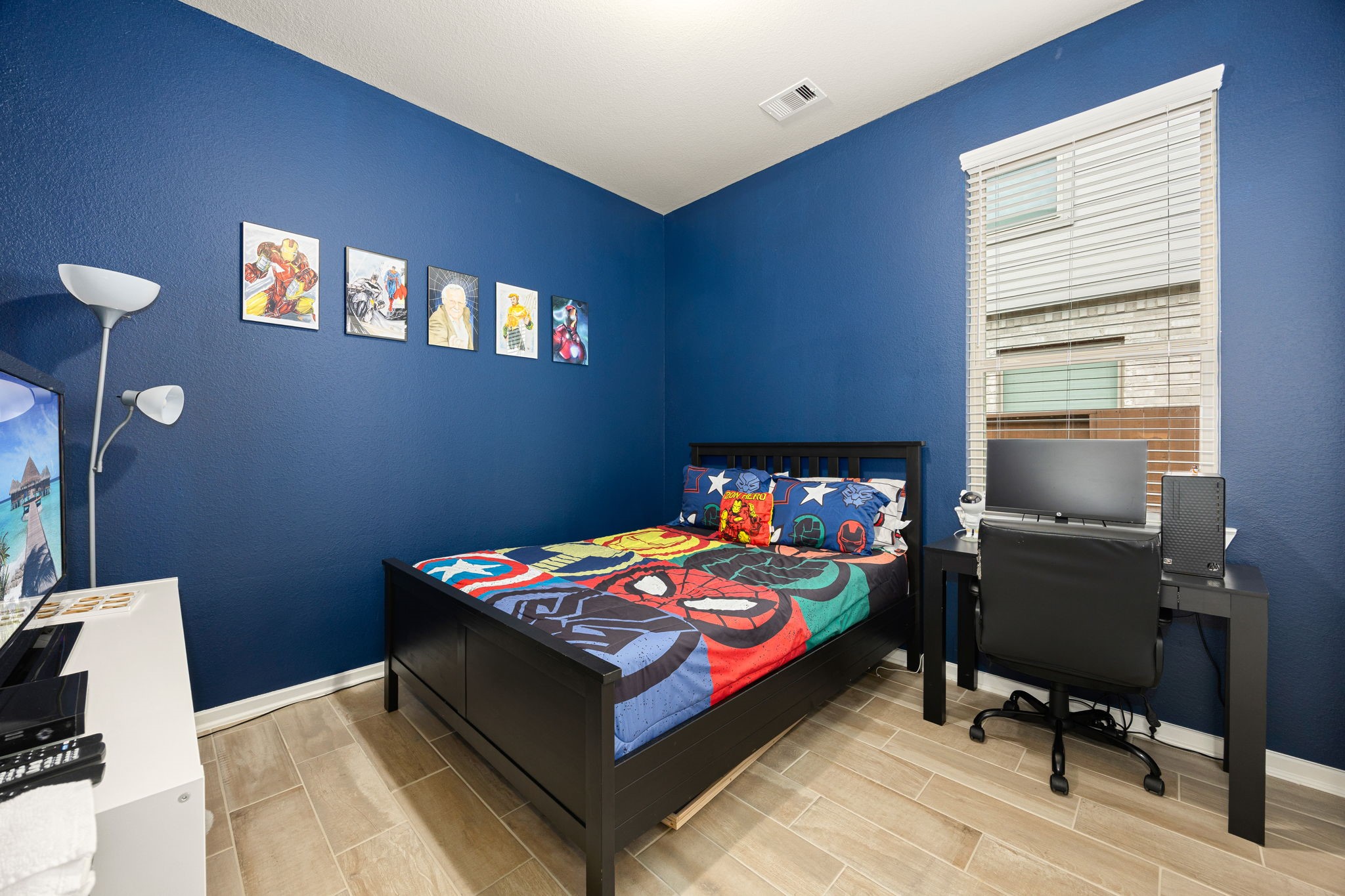 4823 Vaughan Way Iowa Colony, TX 77583 - Photo 20 of 29 a bedroom with a bed and a desk