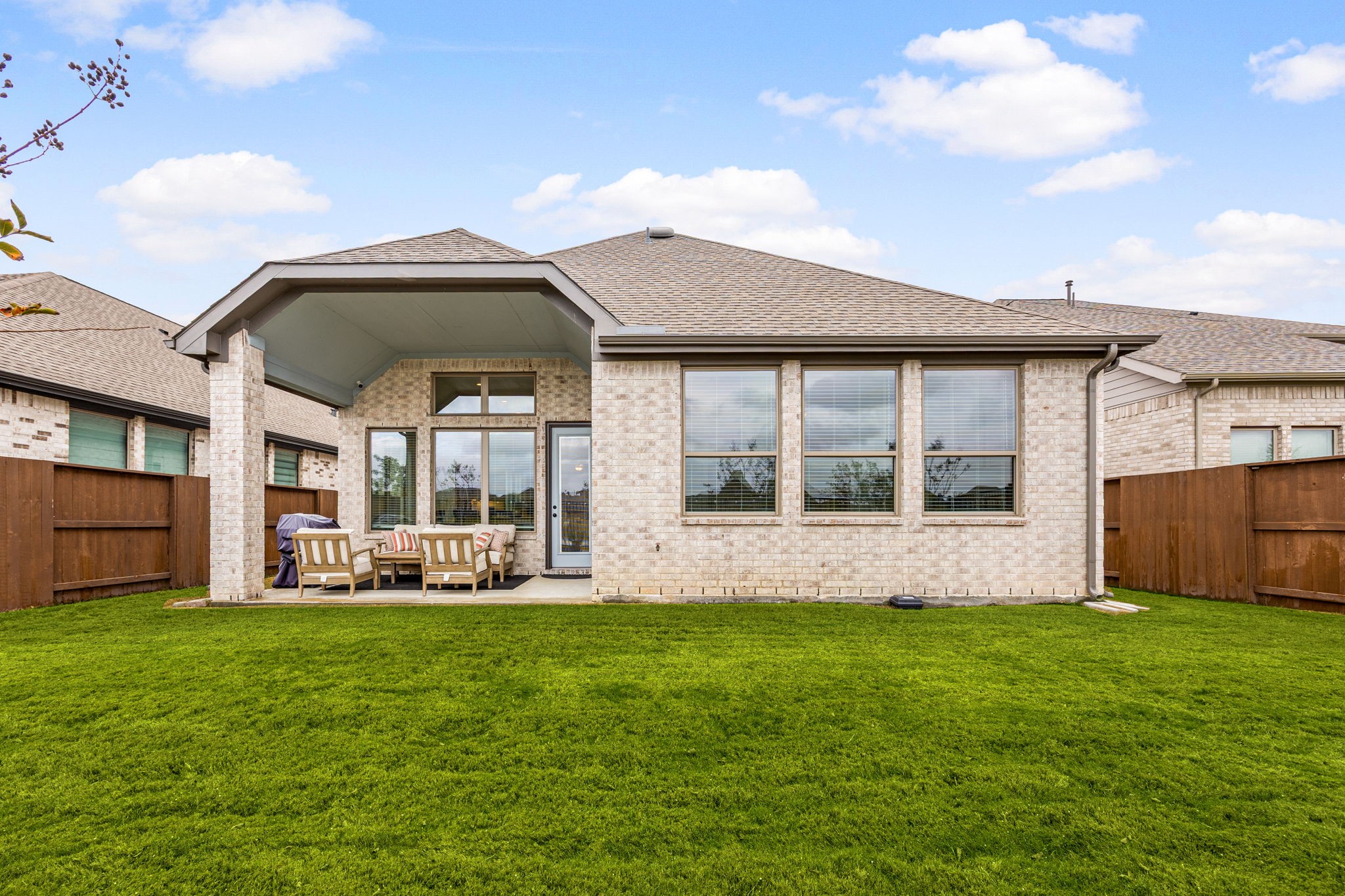 4823 Vaughan Way Iowa Colony, TX 77583 - Photo 23 of 29 a front view of house with yard and porch